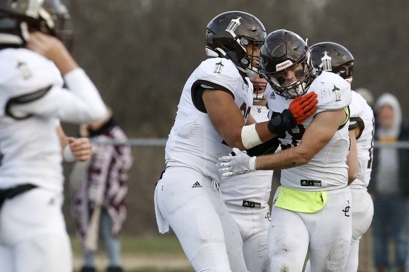 Joliet Catholic's Jordan Anderson celebrates with Vinny Iannantone during their IHSA Class 4A semifinal football game on Saturday, Nov. 20, 2021 at Richmond-Burton High School in Richmond. Joliet Catholic won 35-18, delivering Richmond-Burton their first loss in three years.