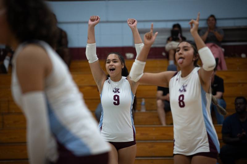 Kankakee's Karmen Rodgers, center, and Elizabeth Avalos, right, react to a win over Grace Christian in a match on Monday, September 22, 2025.