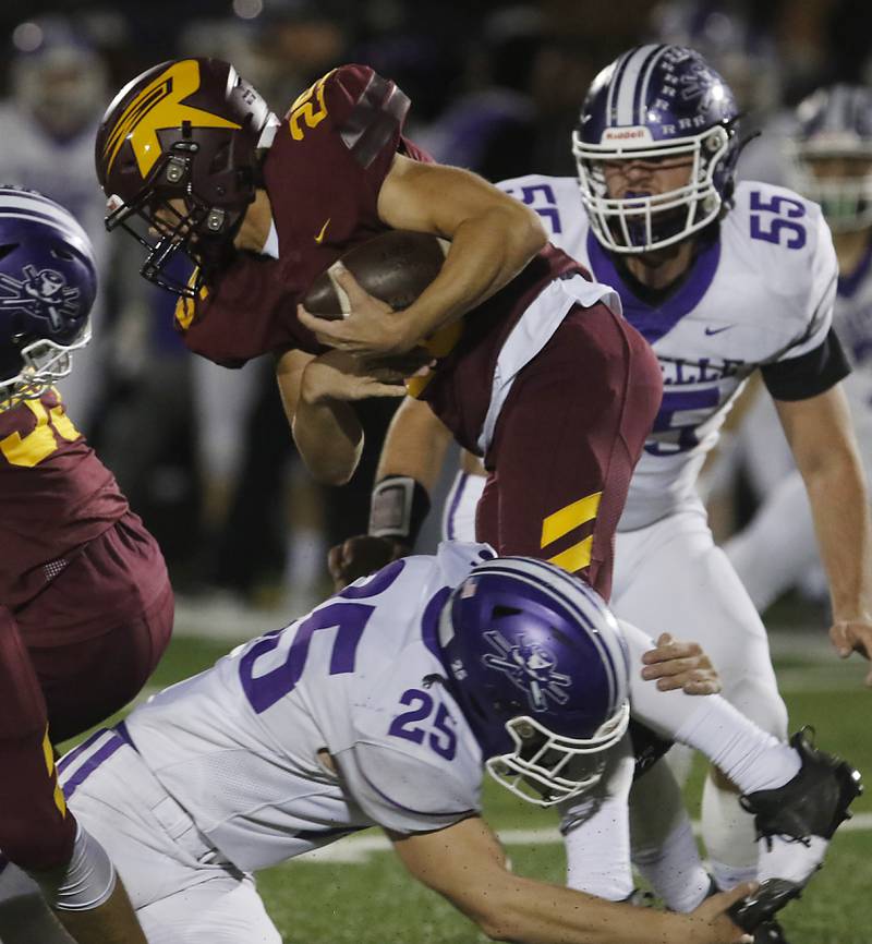 Richmond-Burton's Ryan Saranzak tries to get out of the tackle of Rochelle's Brock Metzger during a Kishwaukee River Conference football game on Friday, Oct.20, 2023, at Richmond-Burton High School.