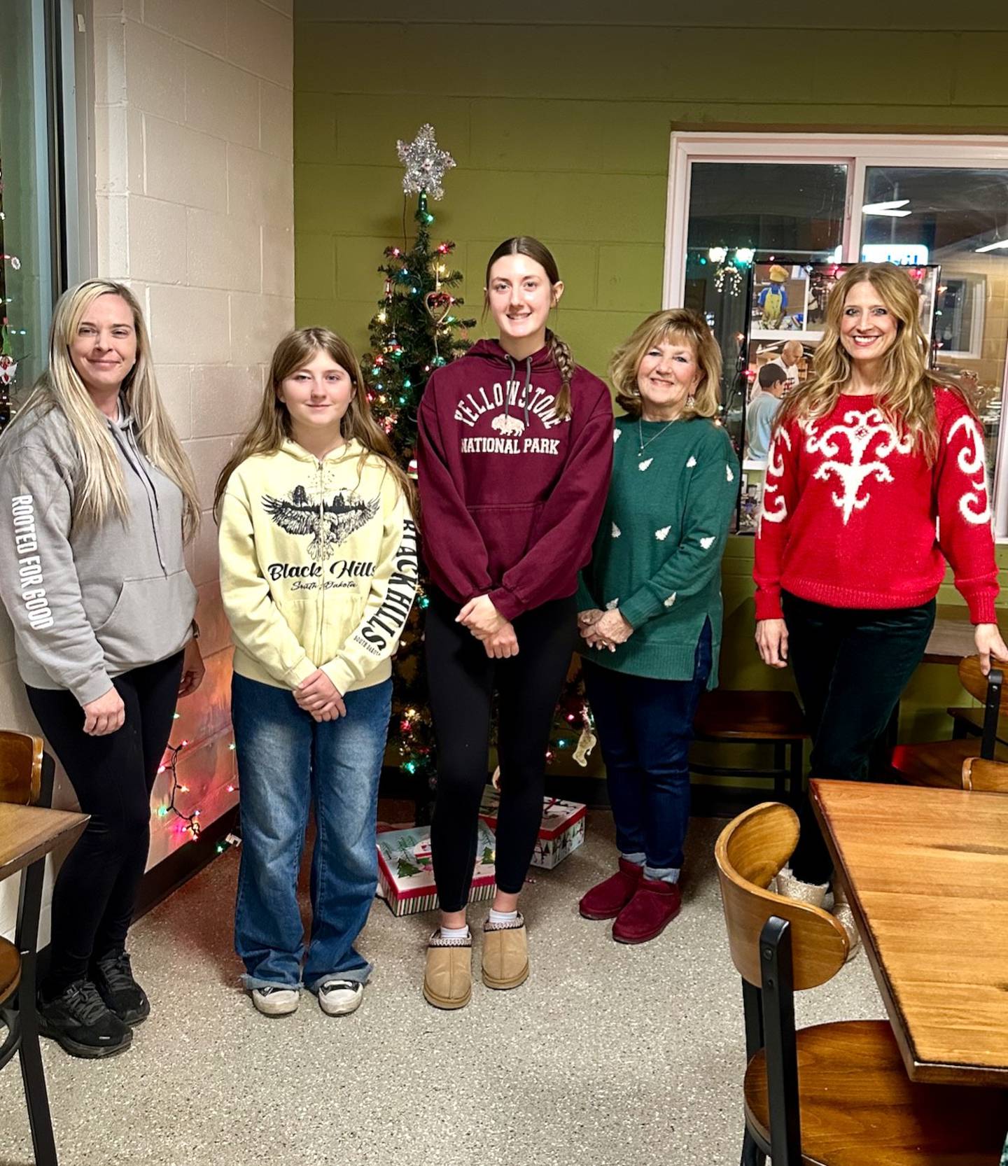 (From left): Haleigh Hunger, Rooted for Good-Genoa program director; Natalie Dodson, Genoa-Kingston High School Impact Club student; Madyson King, Genoa-Kingston High School Impact Club student; Christi Volkening, Genoa-Kingston School District 424 human resources employee and district toy drive organizer; and Tara Wilkins, Genoa-Kingston High School Impact Club advisor, pose for a photo during the Dec. 18, 2024, toy drive.