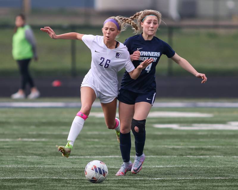 Downers Grove South's Micah Olson (14) collides with Downers Grove North's Audrey Anderson (26) during Class 3A Addison Trail Regional final soccer match between Downers Grove South at Downers Grove North.  May 19, 2023.