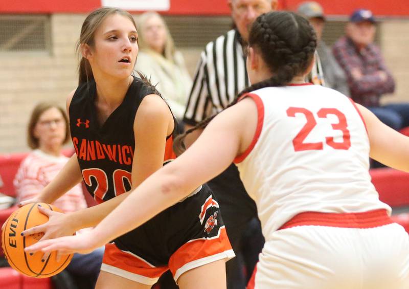 Sandwich's Mia Geltz looks to pass the ball around Ottawa's Mary Stisser on Monday, Jan. 27, 2025 in Kingman Gym at Ottawa High School.