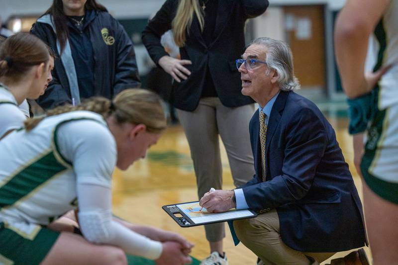 St. Bede Head Coach Tim Ptak talks to team during timeout on Friday, December 26, 2025 at St. Bede High School in Peru.