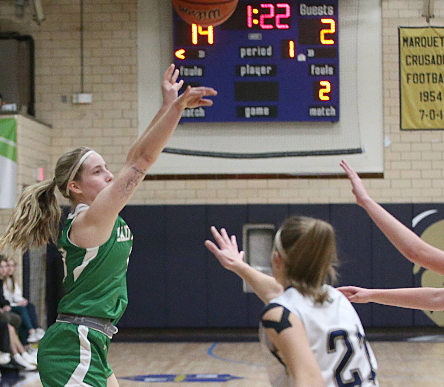 Seneca's Kennedy Hartwig shoots a jump shot over Marquette's Avery Durdan in Bader Gym on Monday, Jan. 23, 2023 at Marquette High School.