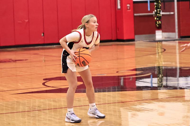 Erie-Prophetstown’s Brynn Brown searches for an open teammate to move the ball up the court on Thursday, Dec. 11, 2025, in the Panthers game against Newman Catholic