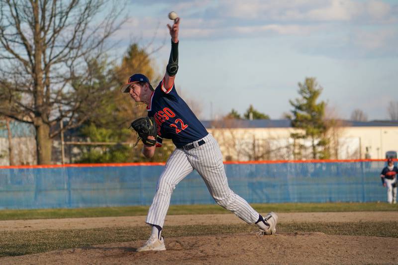 Oswego’s Andrew Zwemke (22) delivers a pitch against Benet during a baseball game at Oswego High School on Tuesday, March 25, 2025.