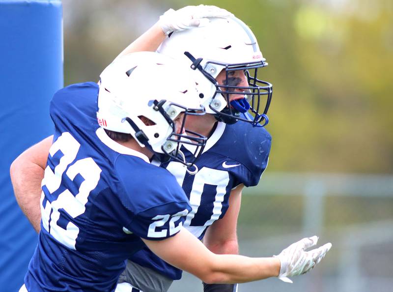 Cary-Grove’s Logan Abrams, right, is greeted by Ryan Lummis, left, after a touchdown against Sycamore in IHSA football Class 5A first-round playoff action at Al Bohrer Field on the campus of Cary-Grove High School in Cary on Saturday, November 1, 2025.