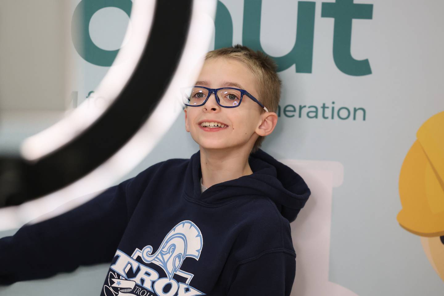 Jayden Stilwell, 11, poses for a photo at the After the Peanut booth at the Will County Executive 2024 Kids’ Fair at Troy Middle School in Plainfield on Monday, Feb. 19, 2024.