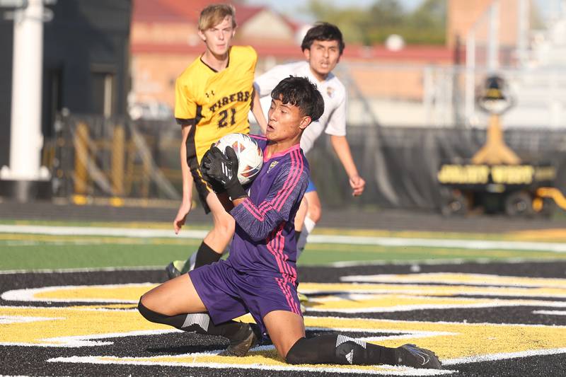 Joliet Central’s Yair Sebastian Reyes drops to make a save against Joliet West on Tuesday, Oct. 3, 2023 in Joliet.