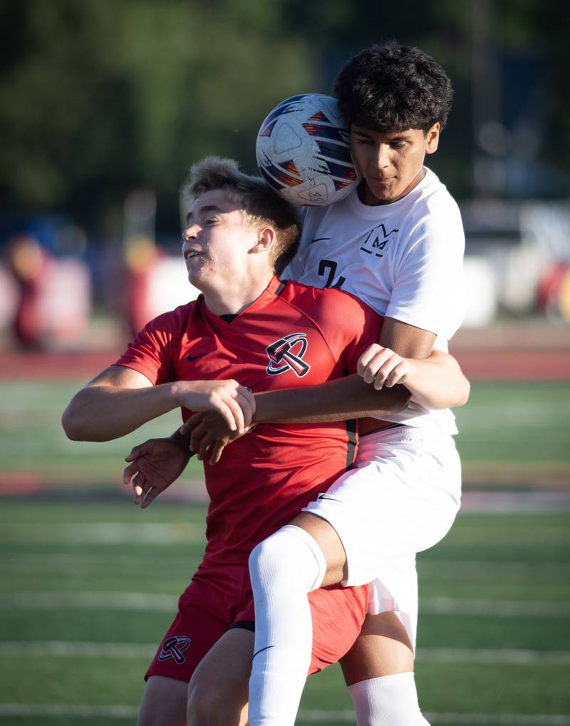 Bradley-Bourbonnais' Jack Watters, left, and Minooka's Aldo Escobedo play the ball in a game on Tuesday, August 26, 2025.