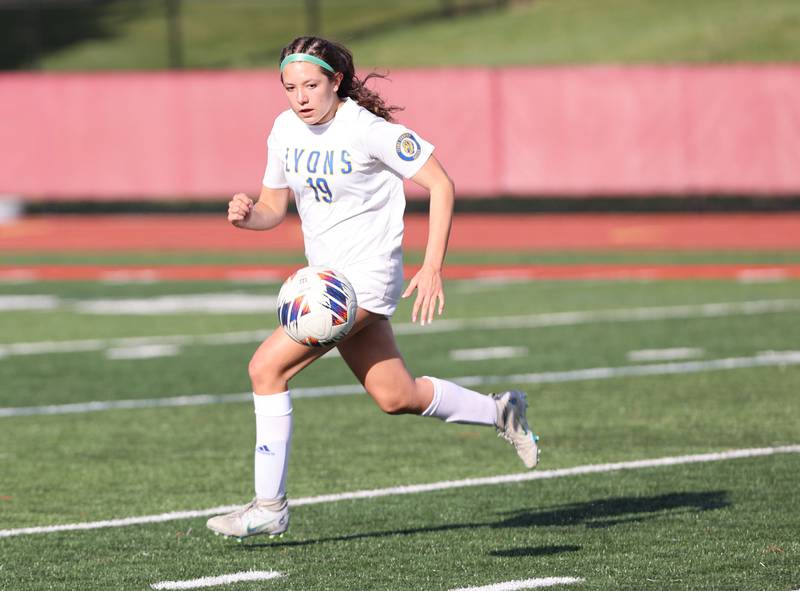 Lyons Township's Brennan Israel (19) chases down the ball during the girls varsity soccer match between Lyons Township and Hinsdale Central high schools in Hinsdale on Tuesday, April 18, 2023.