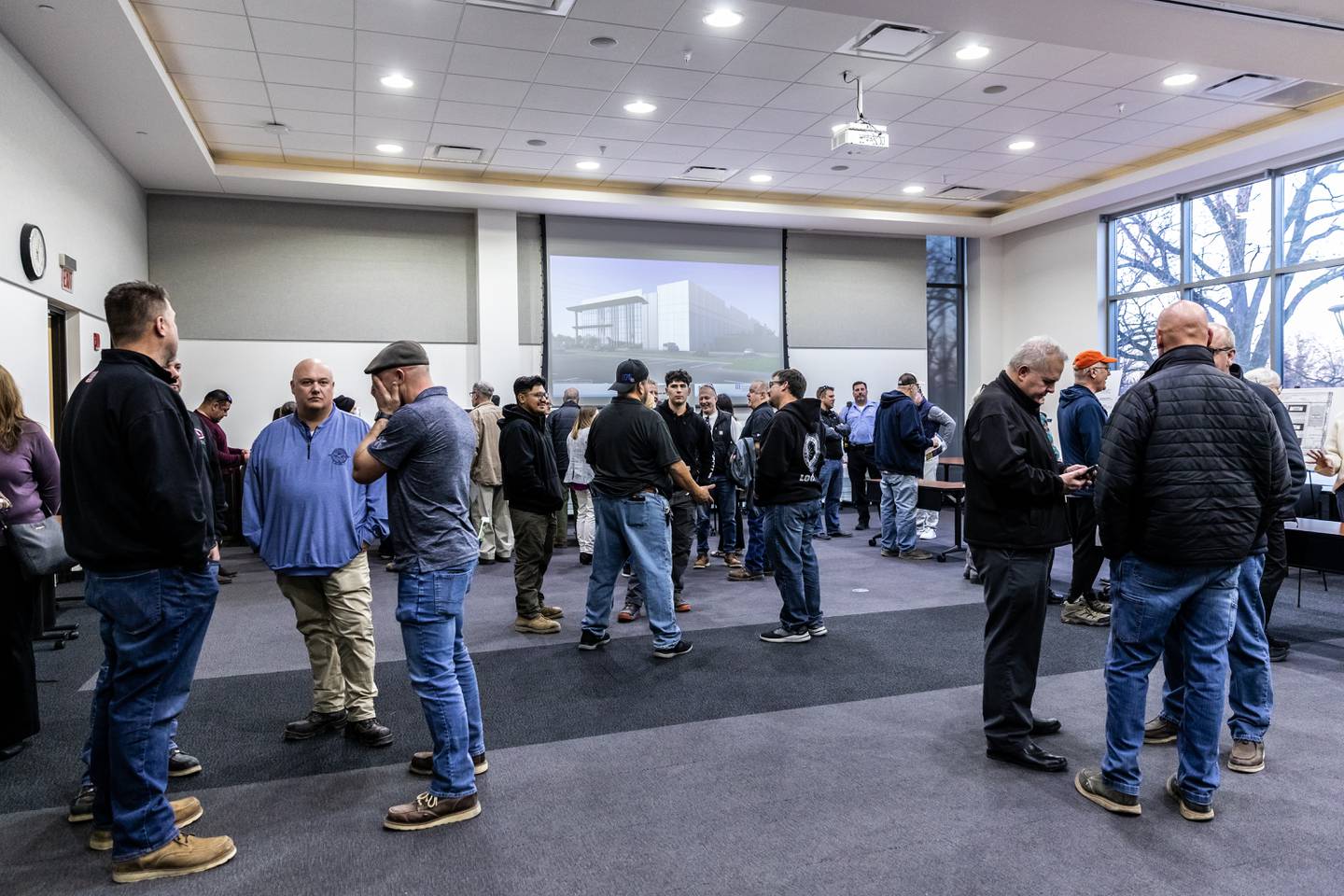 Members of the community attend an open house event regarding the proposed Joliet Technology Center at Joliet Community College on Feb. 12, 2026.