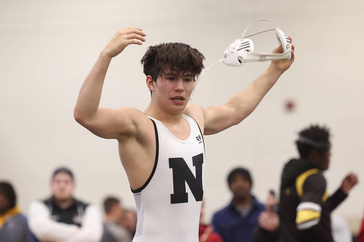 Plainfield North’s Aidan Durell celebrates his comeback win in the final minute against Yorkville’s Nathan Craft in the 126-pound weight SPC Conference championship match at Joliet West on Saturday, Jan 25, 2025.