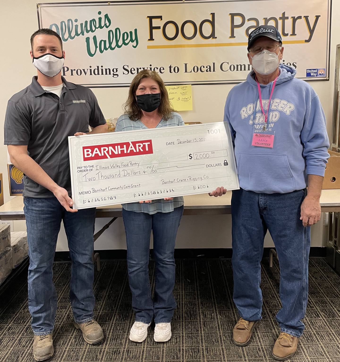 Matt Fiorentini, branch manager for Barnhart Crane and Rigging Co. in Ladd, presents a Barnhart Community Care Grant to Illinois Valley Food Pantry for $2,000.