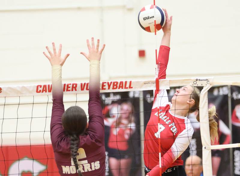 L-P's Aubrey Duttlinger sends a spike past Morris's Alexis Wiliams during the Class 3A Sectional semifinal game on Tuesday, Nov. 4, 2025 in Sellett Gymnasium at L-P High School.
