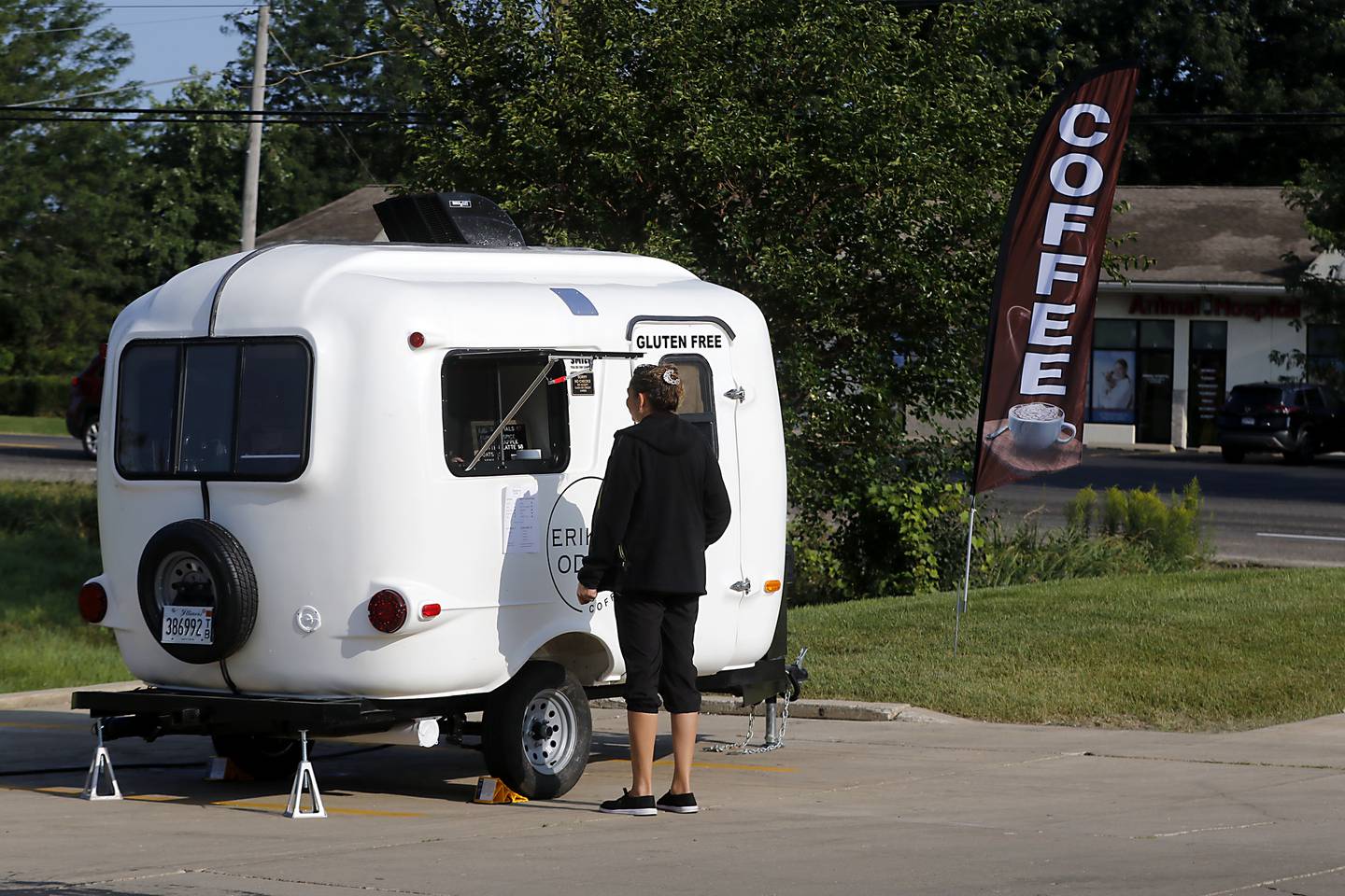 Johnsburg resident Erika Kosick, who started her small business Erika's Odd Coffee recently, talks with customer Kasia Bussan as she sells coffee Thursday, Aug. 22, 2024, from her pop-up trailer in the parking lot of Northbound Fitness Club in Spring Grove. She will also be a vendor at the Johnsburg and Spring Grove farmers markets.