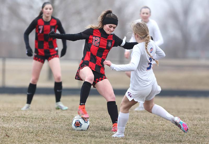 Indian Creek's Emma Turner tries to keep the ball away from Genoa-Kingston's Sophia Zaccard during their game Thursday, March 16, 2023, at Pack Park Sports Complex in Waterman.