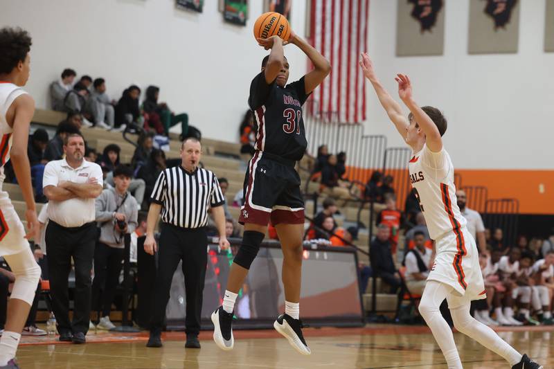 Plainfield North’s Pierre Pointer takes the outside shot against Plainfield East on Tuesday, Jan 14, 2025.
