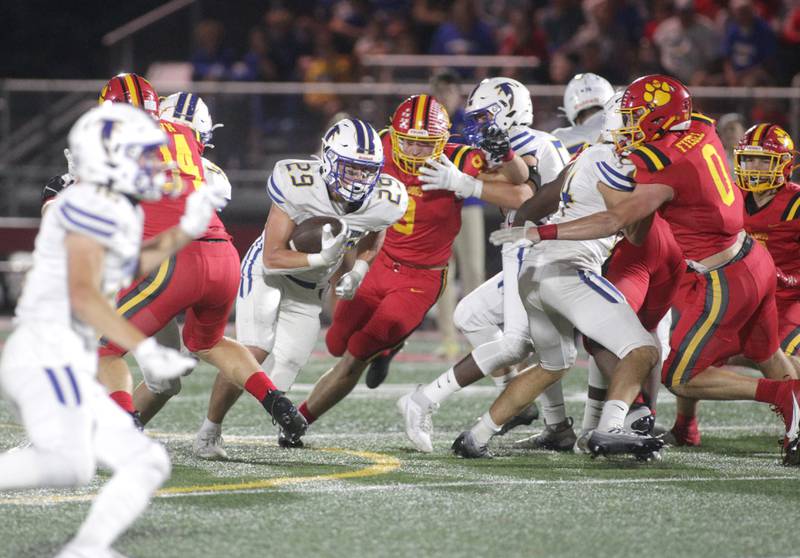 Wheaton North’s Walker Owens runs the ball through the middle during a game at Batavia on Friday, Sept. 22, 2023.