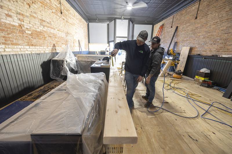 The once center bar is being moved against the western wall in the building.