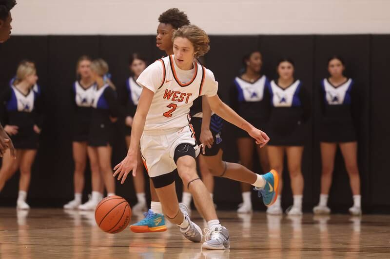 Lincoln-Way West’s Eli Bach makes a move upcourt against Lincoln-Way East.
