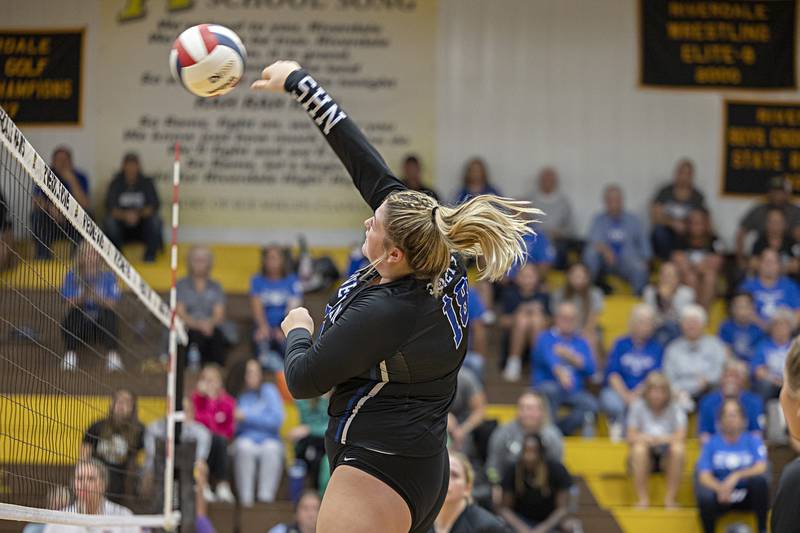 Newman’s Kennedy Rowzee hammers a shot against Erie-Prophetstown Tuesday, Oct. 24, 2023 at the Riverdale volleyball regional.