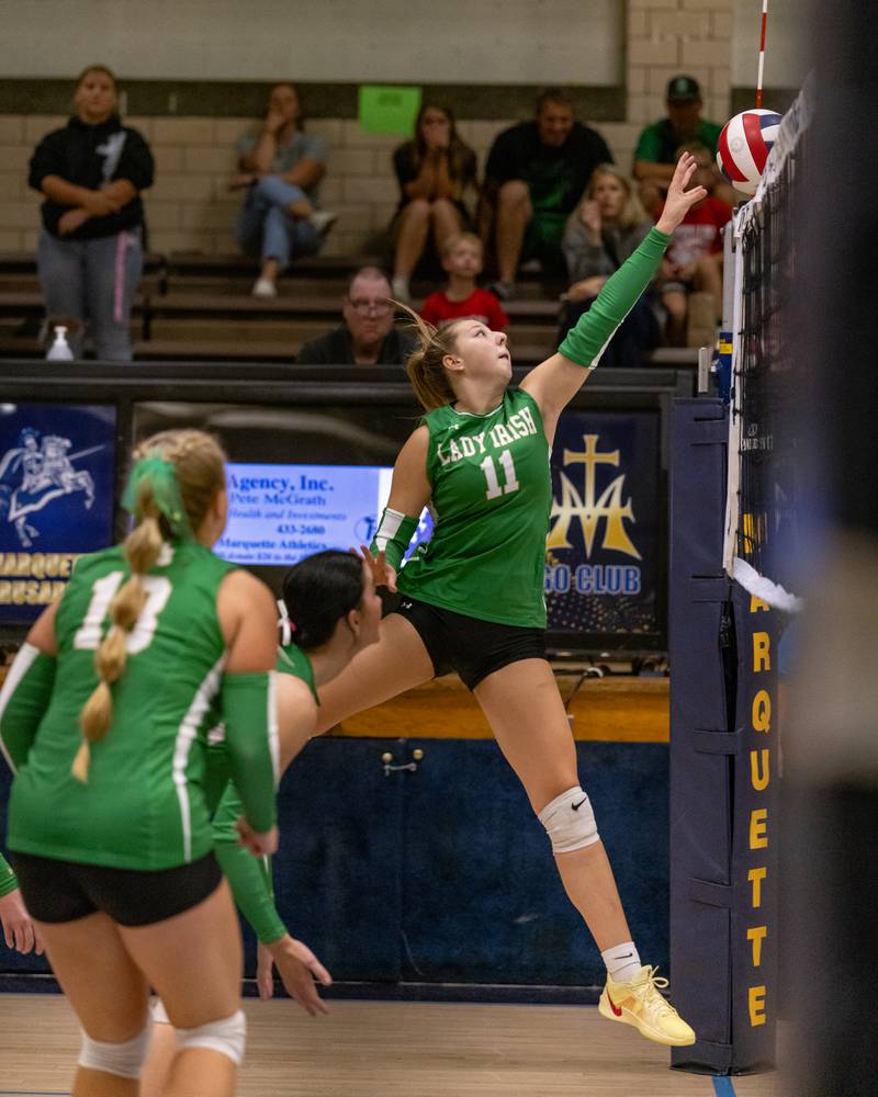 Franki Meyers spikes the ball over the net against Marquette during the match at Bader Gym on September 25, 2025 at Marquette High School