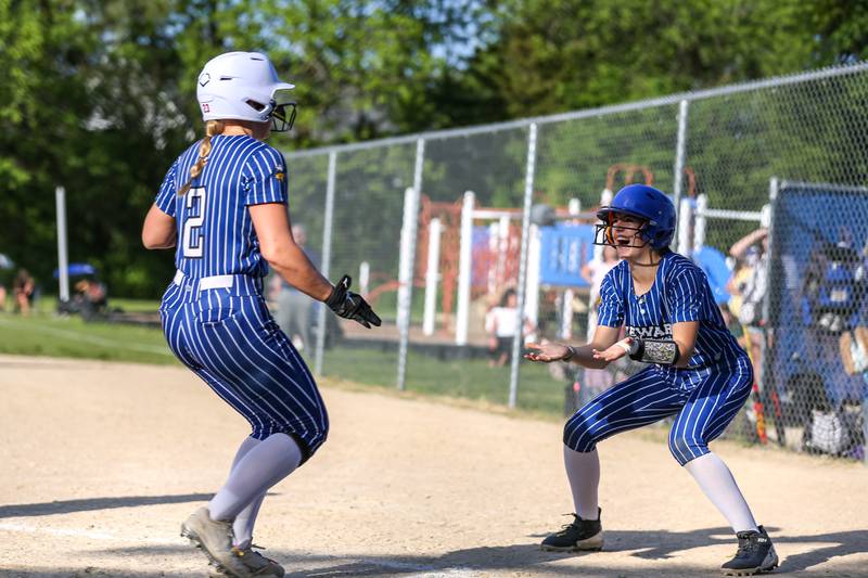 Newark's LeAnn Monsess (0) greets Ryan Williams (2) at home after both score during Class 1A Newark Regional final game between St. Edwards at Newark. May 17th, 2024.