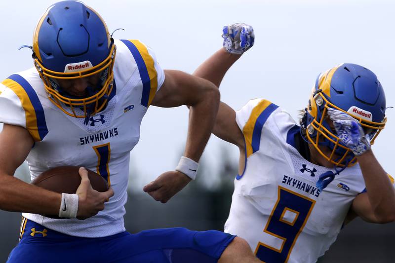 Johnsburg's AJ Bravieri and Landon Johnson celebrate Johnsburg win over Woodstock North in a Kishwaukee River Conference football game Saturday, Aug. 26, 2023, at Woodstock North High School.