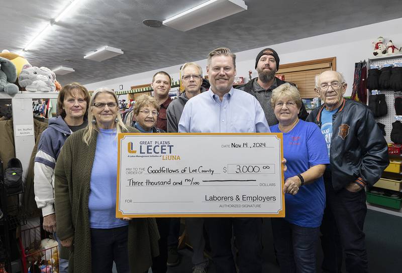 Great Plains Laborers-Employers Cooperation and Education Trust and Laborers Local 727 presents a check to Goodfellows of Lee County for $3000 Thursday, Nov. 14, 2024. The two construction labor unions collect $0.02 for every hour worked and donate that to a charitable organization. Pictured: Goodfellows volunteer Mary Jordan (left), Goodfellows of Lee County President Clara Harris, volunteers Janet Bushman, Ryan Latvaitis, Karl Harris, LECAT Director Dane Simpson, Don Hansen, Local 727, volunteers Linda Erisman and Larry Weinrich.