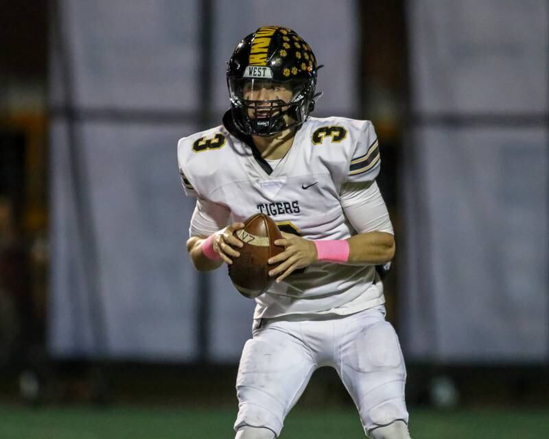 Joliet West's Juan Rico (3) looks for an open receiver during football game between Joliet West at Plainfield Central.   Oct 20, 2023.