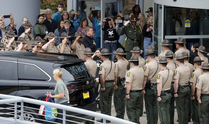 State Police line up to honor Illinois State Police Trooper Brian Frank at  MarionJoy Rehabilitation Hospital as Frank heads home Saturday May 13, 2023.