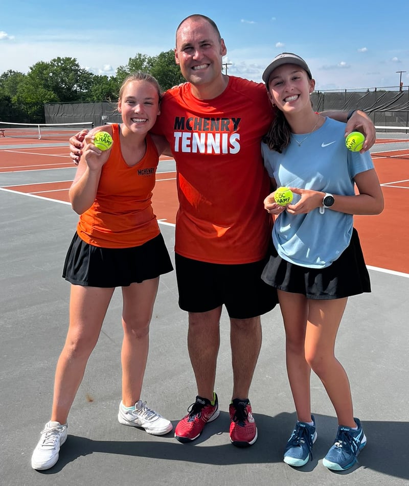 Jon Betts (center) pictured with his daughters, Claire (left) and Grace. Betts has been named the new McHenry girls tennis coach.