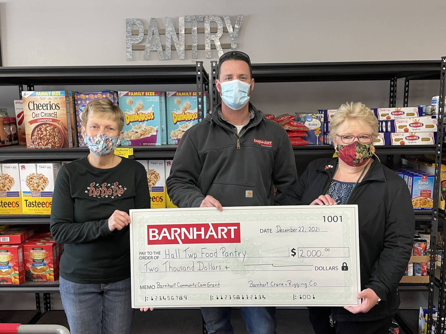 Matt Fiorentini, branch manager for Barnhart Crane and Rigging Co. in Ladd, presents a Barnhart Community Care Grant to Hall Township Food Pantry for $2,000.