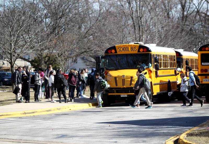 Students leave Geneva High School on March 13, just as President Trump announced that he is declaring the coronavirus pandemic a national emergency. The school had canceled all extra-curricular activities March 13.Students leave Geneva High School on March 13, just as President Trump announced that he is declaring the coronavirus pandemic a national emergency. The school had canceled all extra-curricular activities March 13.