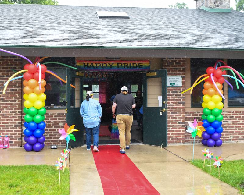 Community members walk into the building at Hopkins Park in DeKalb during the Pride in the 815 event held on Saturday June 1, 2024.