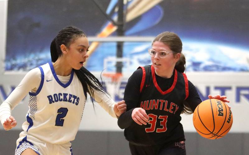 Huntley’s Lainey Flaws, right, looks for an option past Burlington Central’s Jordyn Charles in varsity girls basketball on Monday, Feb. 9, 2026, at Central High School in Burlington.