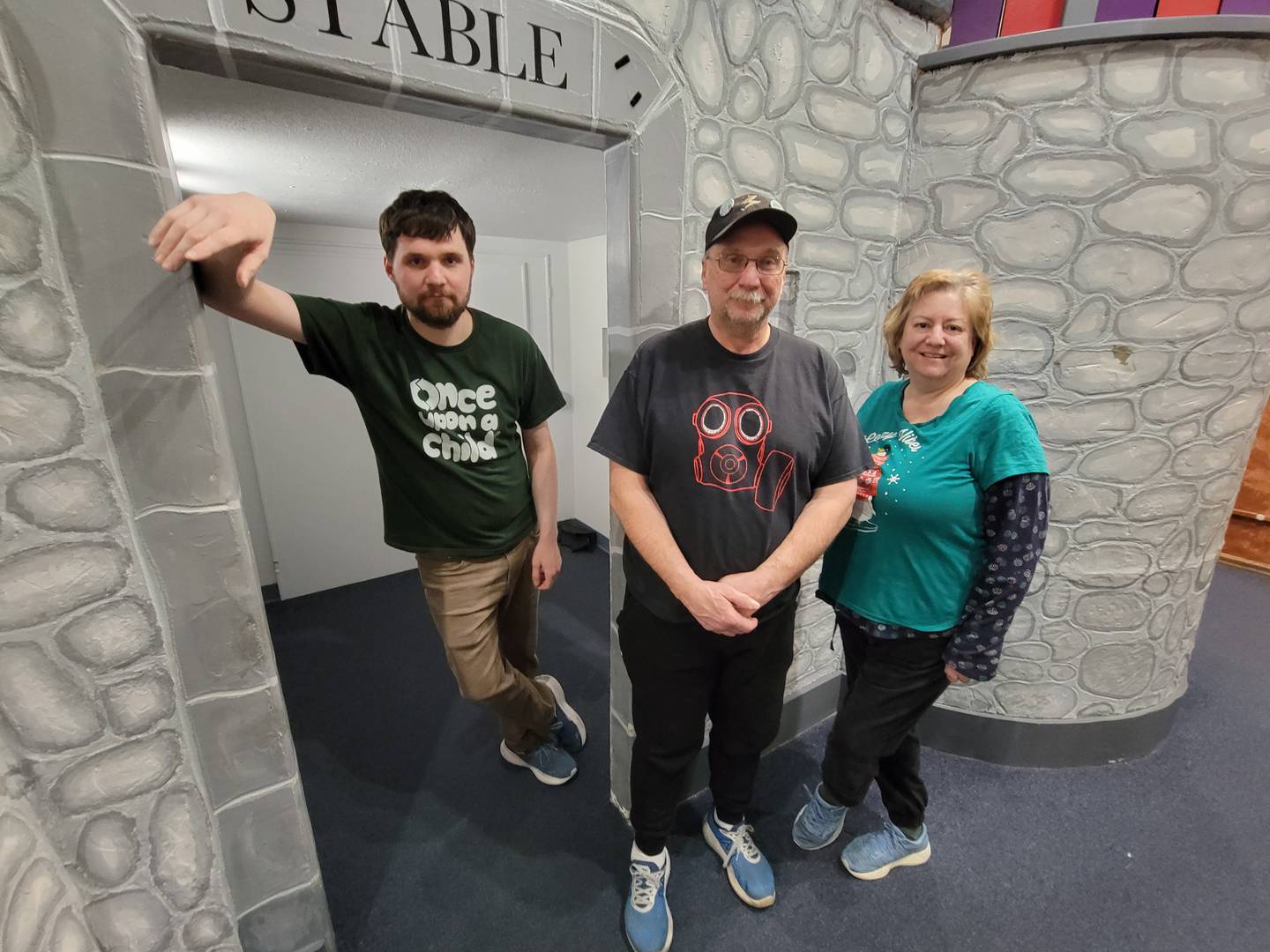 Don and Dawn Kirk and their son Julius, left, drove an hour to say farewell to the Exploralot Castle in the Exploration Station on Feb. 21, 2025. The family has fond memories of visiting the children's museum at Perry Farm Park and playing in the castle 20 years ago.