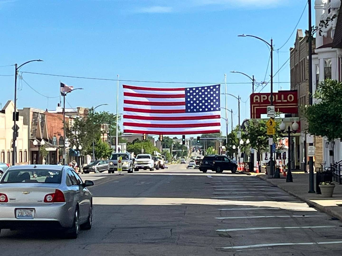 A 60-by-30 foot American flag was set up over Main Street in Princeton on Friday morning, June 17, 2022, ahead of the city’s first summer concert, but the flag poles snapped and the pole supporting the flag landed on the ground.