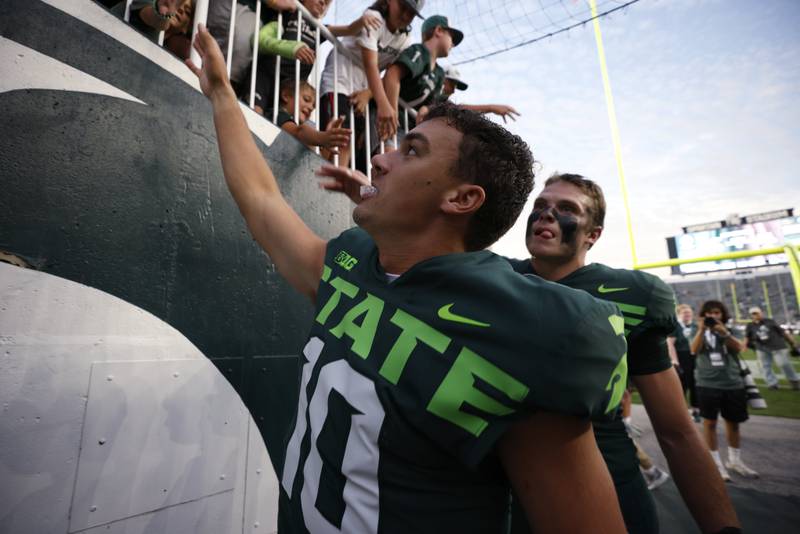 Michigan State quarterback Payton Thorne greets fans following an NCAA college football game against Akron, Saturday, Sept. 10, 2022, in East Lansing, Mich. Michigan State won 52-0. (AP Photo/Al Goldis)