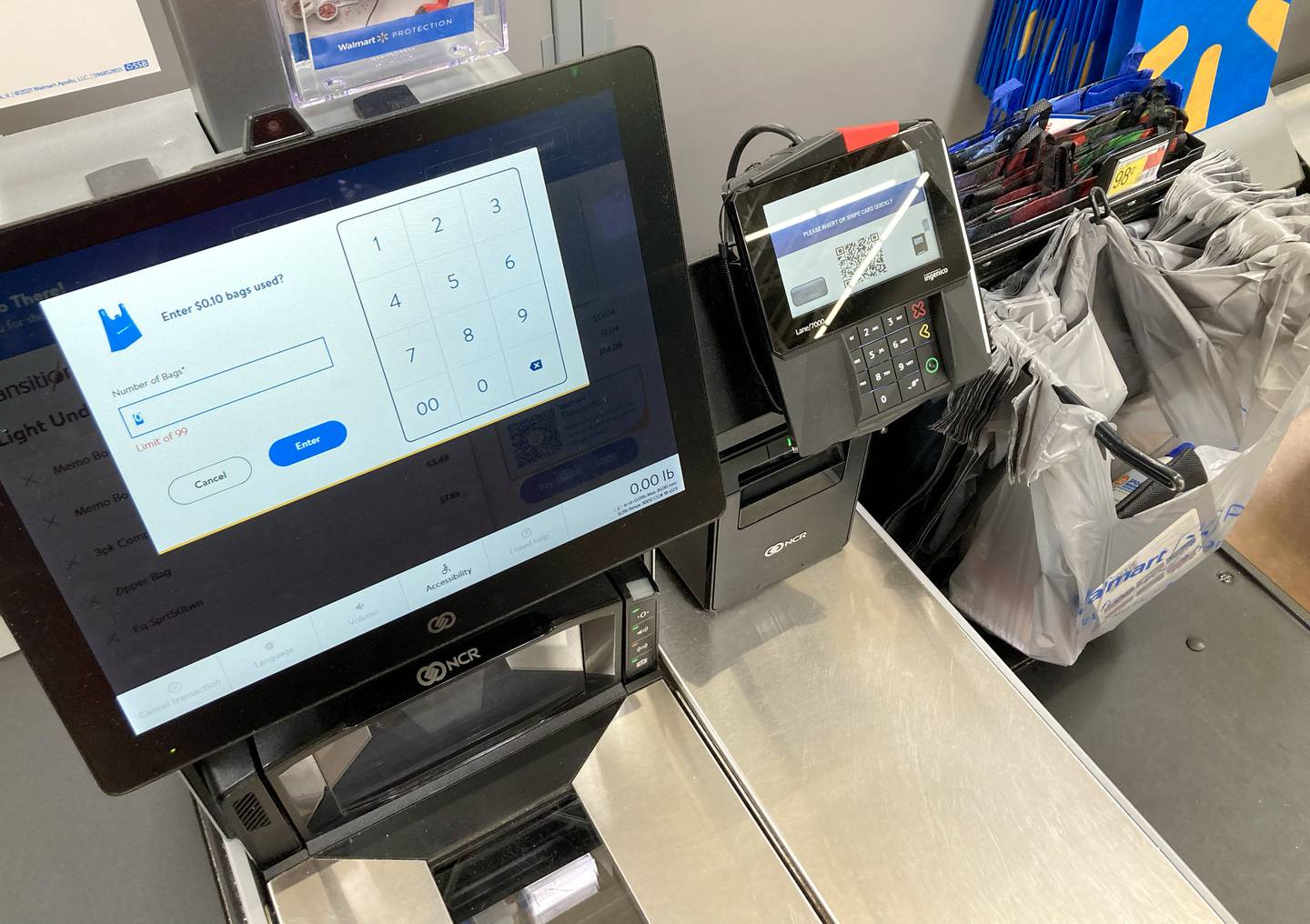 The self-checkout terminal at Walmart in asks how many bags you used while checking out of the store on Friday, July 28, 2023.  Woodstock in the only McHenry County community to charge a bag fee.