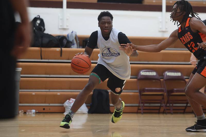 Joliet Central’s Jaylin Adams makes a baseline mover against DeKalb at the 37th Morris Boys Shootout on Tuesday, June 25, 2024.