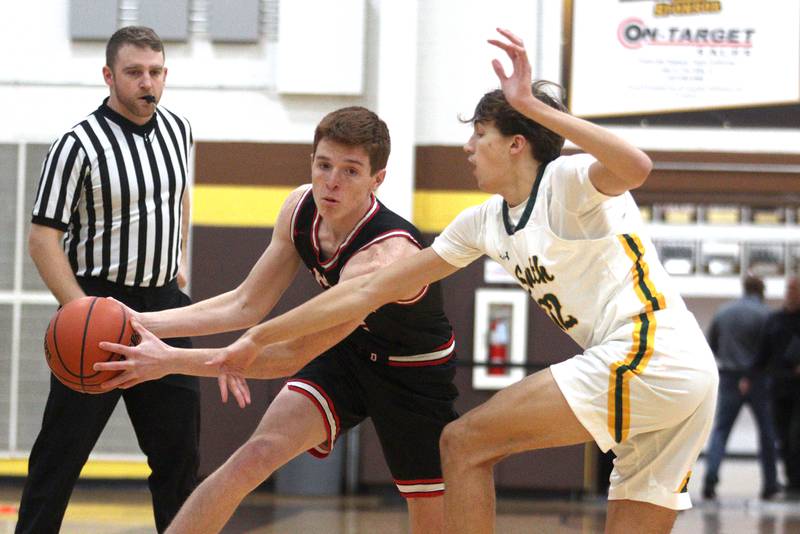 Crystal Lake South’s  Tony Santarelli, right, guards Barrington’s Adam Baird in Hinkle Holiday Classic boys basketball tournament game action at Jacobs High School Tuesday.