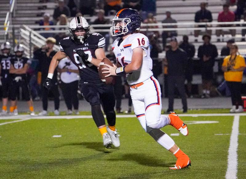 Oswego’s Brett Connolly (16) scrambles out of the pocket chased by Plainfield North's Colin Meyers (99) during a football game at Plainfield North High School on Friday, Sept. 22, 2023.