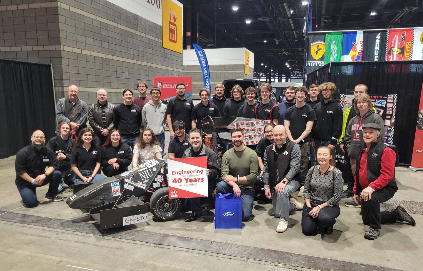 Members of NIU Huskie Motorsports and the Chicago section of the Society of Automotive Engineers (SAE) gather at the Chicago Auto Show on Feb. 6, 2026, the day before the show's public opening