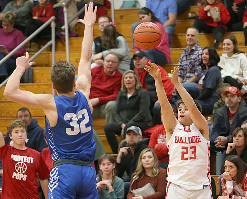 Streator's Logan Aukland shoots a three-point basket over Peotone's Miles Heflin on Friday, Jan. 20, 2023 at Streator High School.