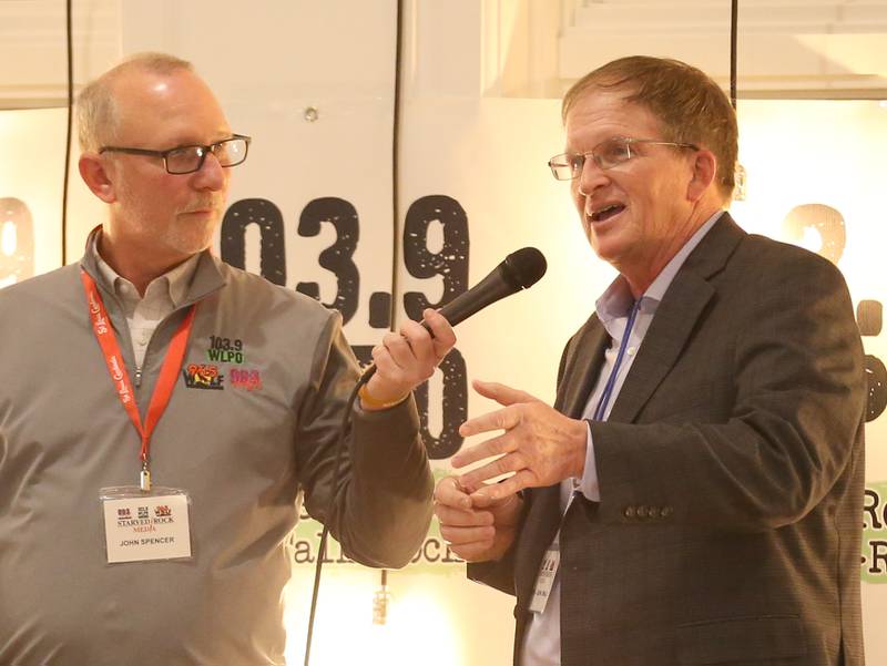 John Spencer, Starved Rock Media president interviews WLPO news ancor John Small on stage during the WLPO 75th Anniversary party on Wednesday, Nov. 16, 2022 at Senicas Oak Ridge in La Salle. Small began working at WLPO in 1977 and is the stations longest employee.