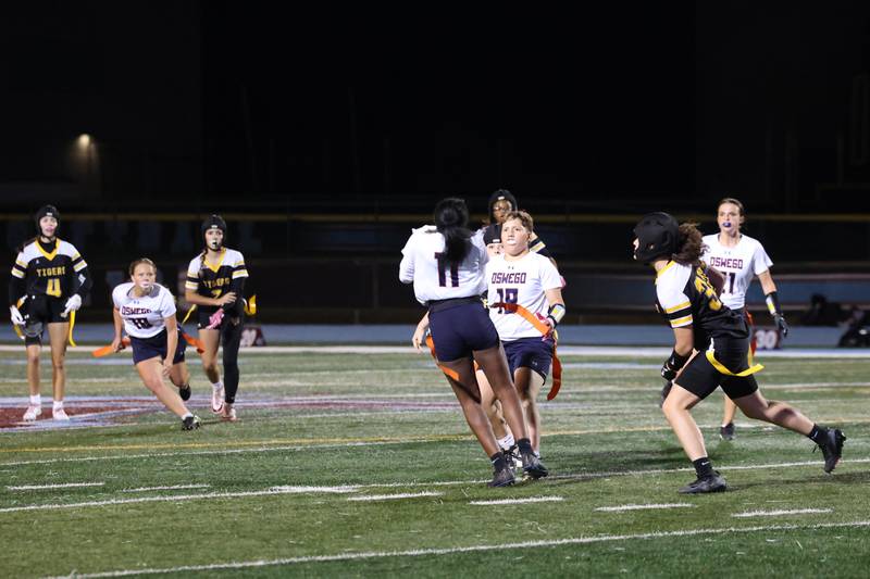 Oswego's Jazmin Hurston (11) catches a pick late in the fourth quarter during the Panthers' 13-7 victory over Joliet West on Tuesday, Oct. 7, 2025.