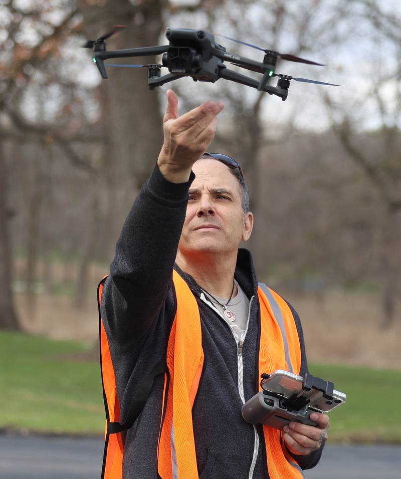 Anthony Tortoriello, of DeKalb, lands his drone in his hand Monday, April 6, 2026, at Hopkins Park in DeKalb.