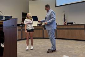 Morris congratulates 3-time IESA champion Caputo on track and field accomplishments